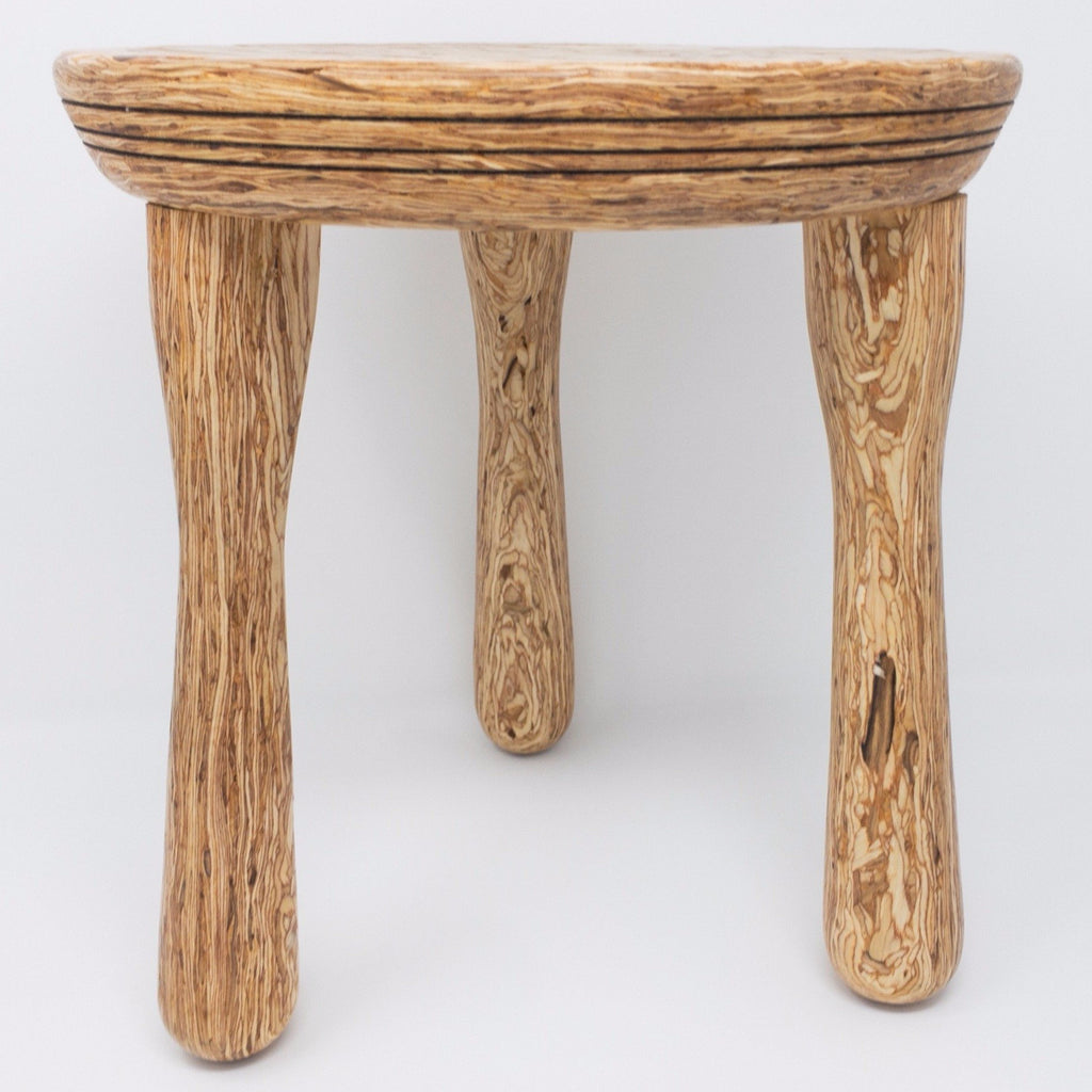 Three legged stool made of Parlam wood. Visually delightful.
